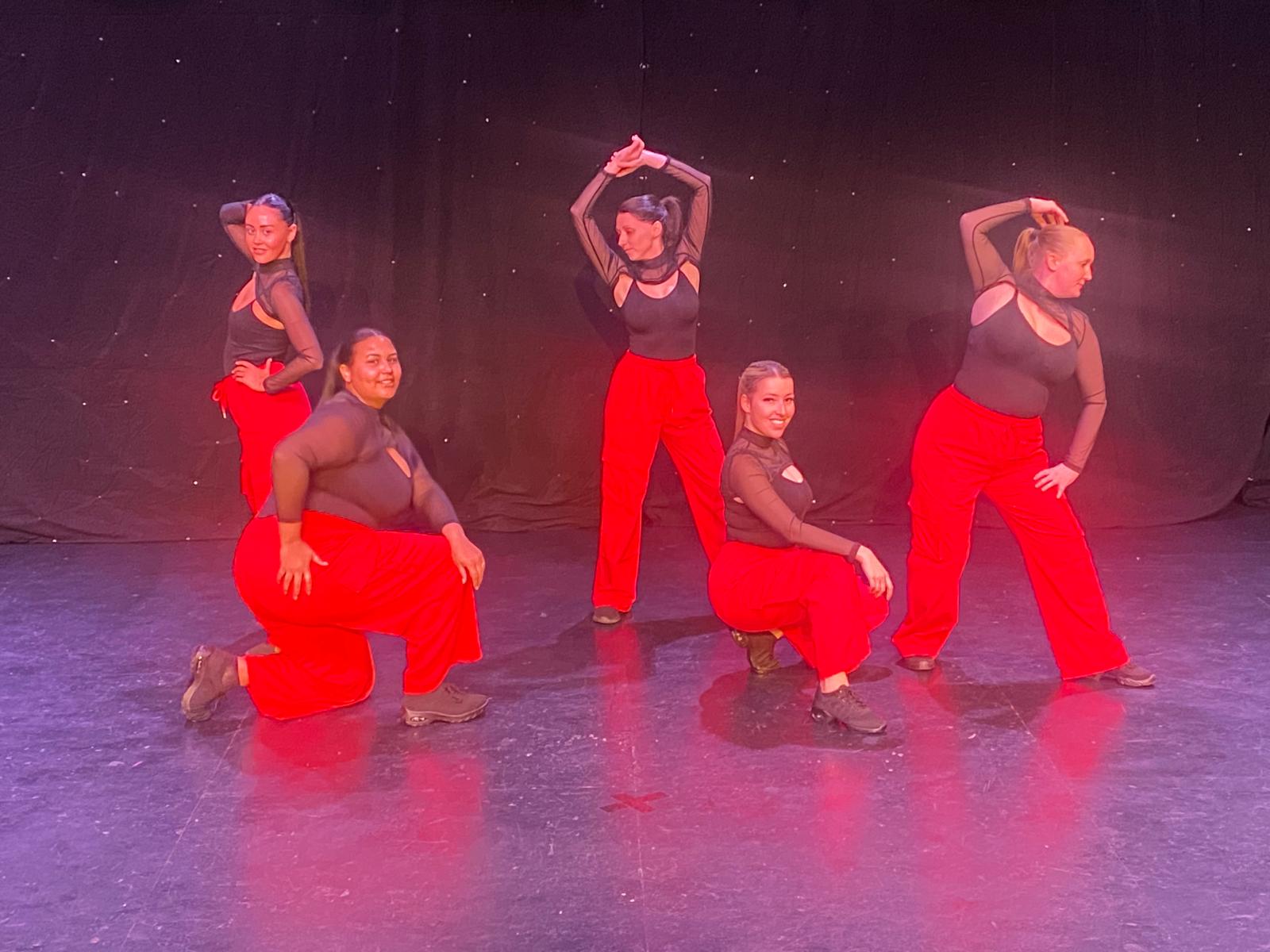 Cheer dance students mid-routine at Bradford theatre show